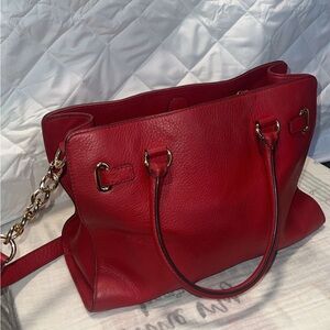 Red leather Michael Kors purse with crossbody strap